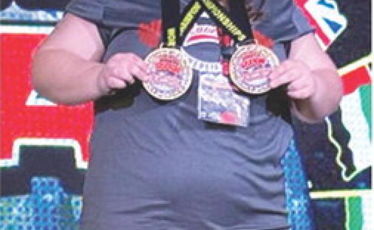 Lizzy Welch, former CUHS Lady Titan Powerlifter and current Coffeyville Red Raven Freshman, won the World Championship Title in her first powerlifting competition with the team. Courtesy photo.