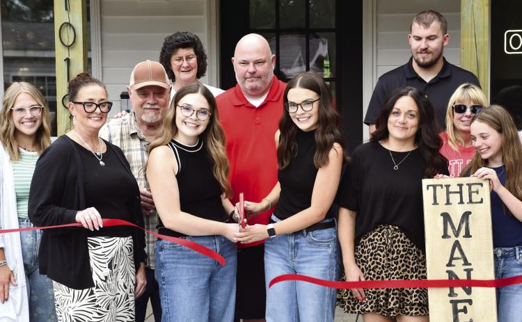A ribbon cutting and presentation of the first dollar was held at the newest hair salon in Columbus. The Mane Look, was built from the ground up by Columbus High School Alums Hayden and Peyton Allen. They were presented their first dollar (at right) by Rebecca Spooner, Columbus Chamber of Commerce President.