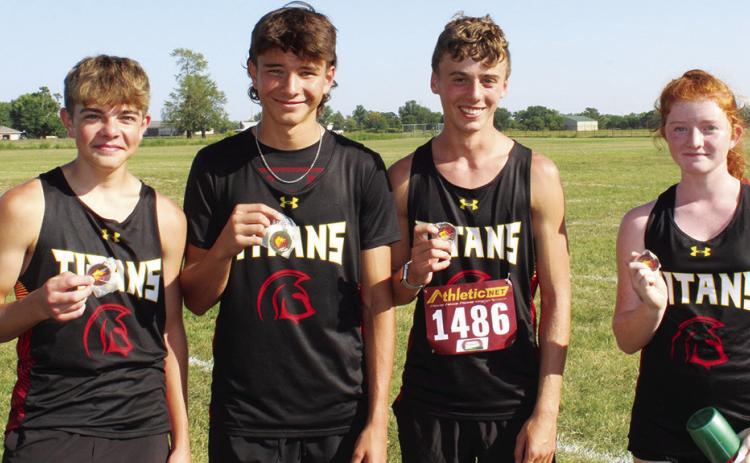 The Columbus Titan Junior Varsity Cross Country Team collected hardware, Thursday as they opened their season at the Labette County meet in Altamont. Freshmen, Easton Long, Drake Laurance, Levi Simpson and Kennedy Reichardt all raced to top 15 places in the junior varsity 5K event. Courtesy photo.