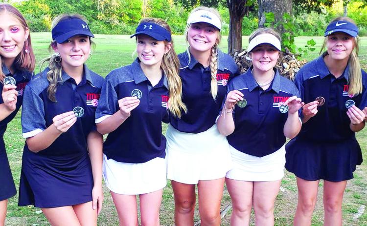 Members of the Lady Titan Varsity and Junior Varsity Golf Teams played a duel tournament at the Country Side Golf Course in Pittsburg, September 26. The varsity squad took second led by Mallory Thompson, sophomore, in first place. Varsity and junior varsity players are: Anna Head, sophomore; Reese Grundy, junior; Paige Patton, freshman; Suzan Crowe, junior; Emily Buffington, freshman; Kenlyn Christiansoen, senior; and Mallory Thompson, sophomore. Courtesy Photo.