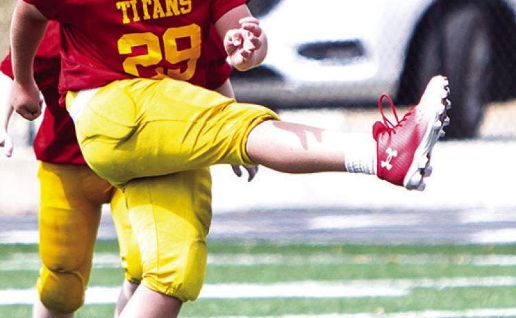 Kayden Fleshman kicked off for the Columbus Titan Fifth/Sixth Grade Titans in their win over Pittsburg Woods, 20-6, September 21, in Pittsburg. Photo by Kristin Sharp.