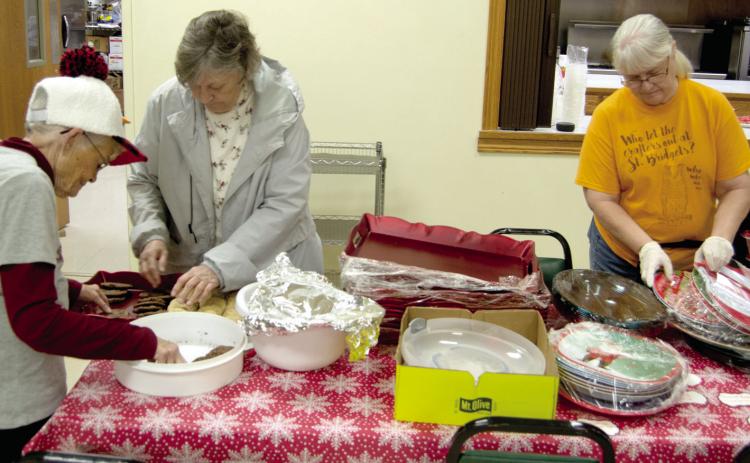 Friday night prior to the St. Bridget’s annual cookie walk, Betty Jansen, Nancy Herrenbruck and Mary Otto readied the serving trays and other necessities for Saturday’s big event. The event was well attended and a large variety of holiday treats were available.