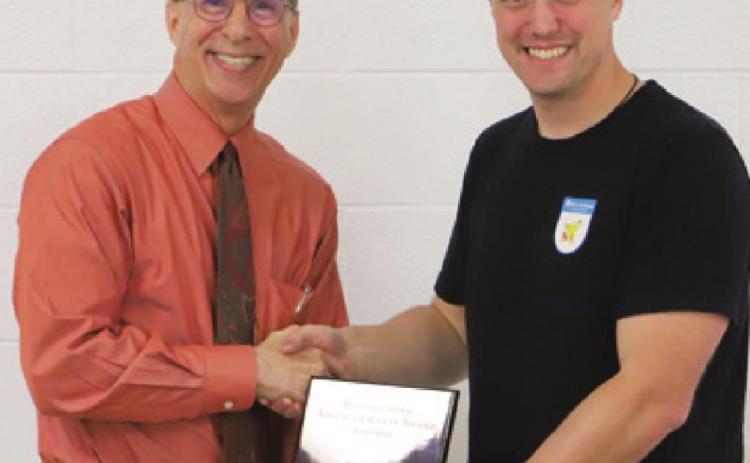 Luke Henke (right), Columbus High School teacher has been awarded the Adjunct Faculty Member of the Year award at Labette Community College. The award was presented by LCC President Mark Watkins.