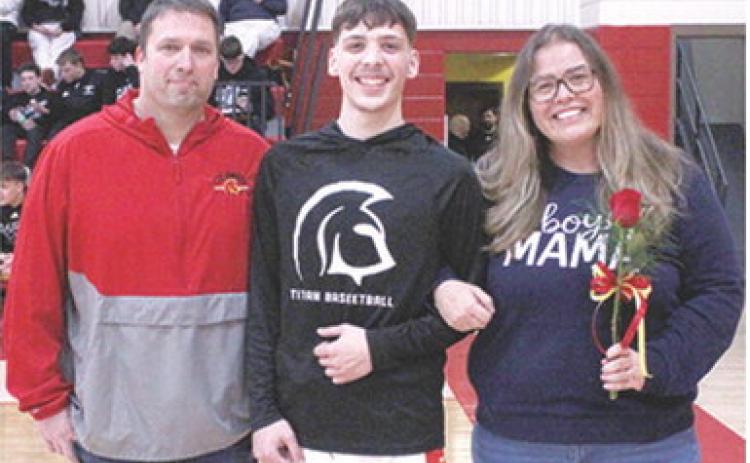 Titan Senior, Julien Basuari, was recognized during Senior Night at the Titans final home game against Frontenac, Monday night at the CUHS Gymnasium. Julien is a one year member of the Titan Basketball Team. He was escorted by his parents Justin and Misty Smith.