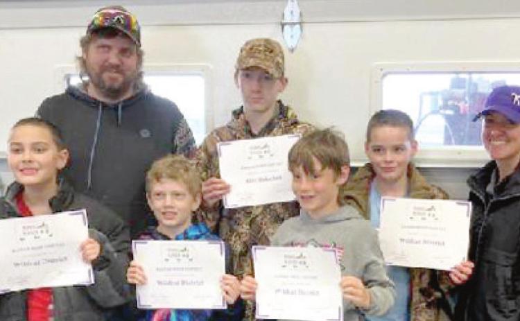 A newly-formed Wildcat District 4-H Wildlife Team recently received second place junior team at the Kansas WHEP (Wildlife Habitat Education Program) Competition at Woodson State Fishing Lake in Toronto. Members include front row: left to right: Brian Longan, Damien Evans, Raylan Elsworth. Back row left to right: Brian Elsworth (coach), Alex Dolechek, Phillip Longan, and Adaven Scronce (coach). Courtesy photo.