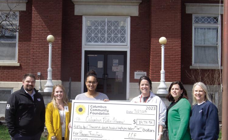 Columbus Public Library received a memorial donation from former Columbus resident Barbara Lee Thomas. Those attending the check presentation included Matt Case, Angie Saporito, Library Lauren Chesner Dainty, Kelly Walters, Jennifer Thompson, Janet Graham. Inset: Barbara Thomas.