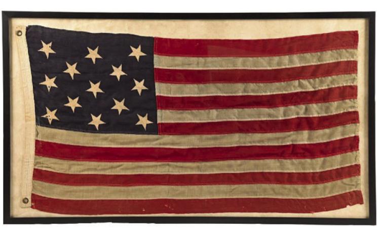 A framed antique American flag features 13 stars, just like the original design approved by the Continental Congress.Photo Credit: Morphy Auctions (c) 2026 by Cowles Syndicate Inc.