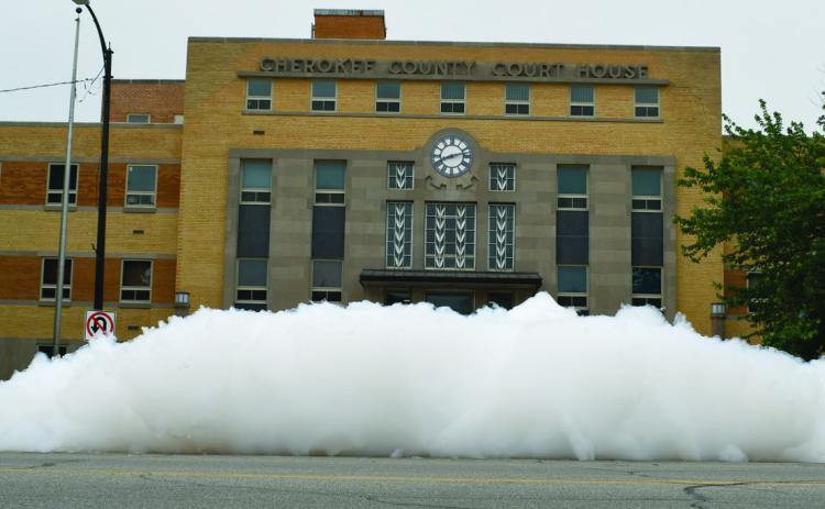 This year’s senior class filled the fountain to overflowing with an enormous pile of bubbles. The foam was so tall it was impossible to see the front doors of the courthouse from across the street. The foam lasted for a couple of days in various stages of height and thickness. A common sight was balls of foam floating through the air. Photo by Thomas Niegisch.