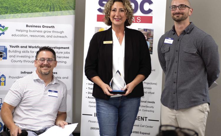 Plaques were presented during the annual recognition breakfast held by the Cherokee County Economic Development Corporation October 7. Above, Sally Davis of Davis Real Estate was presented the Hall of Fame Award at this year’s breakfast. Below, Patti Street accepted the Community Impact award on behalf of Dream Big Little One. Both awardees are based in Columbus. Brian Smith and Jake Letner presented the plaques.