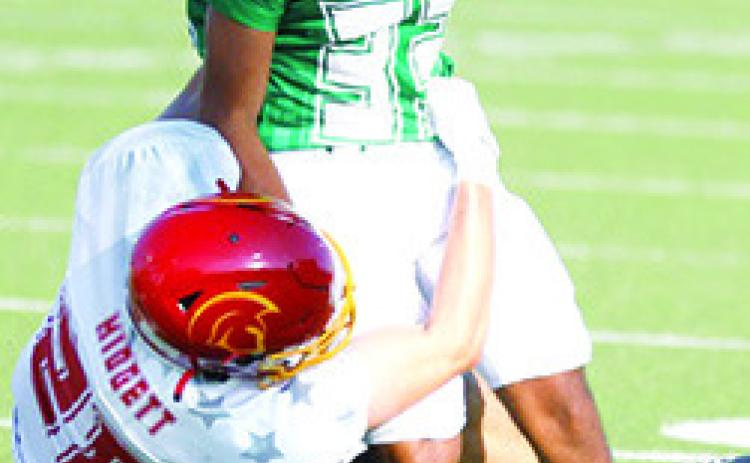 Columbus Titan 2023 Graduate, Landin Midgett, playing for the East Team brings down a West player during the 50th Annual Kansas Shrine Bowl All-Star Game, Saturday, in Hays. The West Squad held off a late charge by the East Team to take the win, 2120, late in the fourth quarter. Photo by Rick Peterson Jr./KSHSAA Covered.