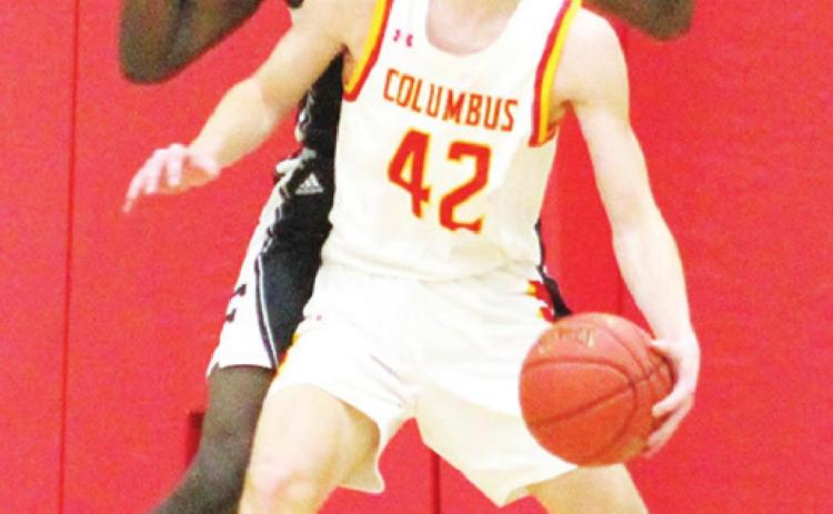 Titan Sophomore, Seth Stover, works against 6’11” Frontenac Junior, Jordan Fudge, under the basket during the Titan Varsity loss to the Raiders, 54-47, Friday night at the CUHS Gymnasium.