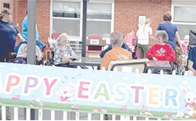 Residents and staff of Medicalodges in Columbus enjoyed the fresh air as they watched the children search for eggs at the annual Easter egg hunt sponsored by the facility.