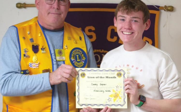 Mark Winter presented February Lion of the Month Casey Soper with his certificate at a recent Lions Club Meeting.