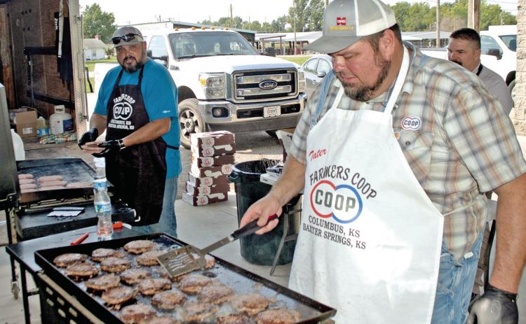 Farmers Co-op employees were busy frying hamburgers to fill the bags in recognition of the first responders in Cherokee County. Chefs Josh Green, Mike Soper and Matt Case fried more than a hundred burgers for the event