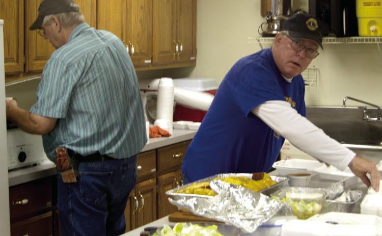 Lions Club members Brad Gleason and Mark Winter were busy preparing the meal served at the Lions Club vegetable soup and bean feed. The event was held at the St. Rose Parish Hall on Thursday at noon and evening.