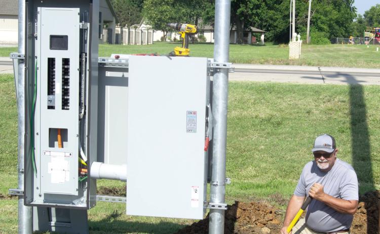 The first electric car fast charge station in Columbus was installed Thursday at the Hatfield Chevrolet dealership. The charging station was installed by Bolding Electric. Trey Bolding was working on the underground electrical connection. The stations are expected to be available for use next week.