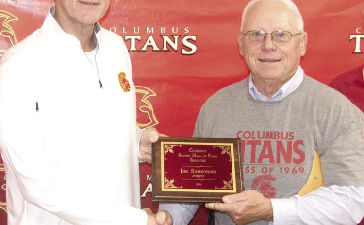 Hall of Fame Chairman Kerry Sachetta presented inductee Jim Sarwinski his plaque during the ceremony.