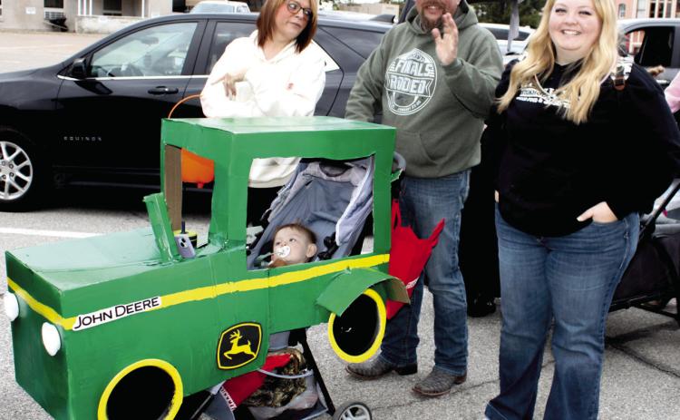 “Nothing runs like a Deere”, even during the Halloween Walk in Columbus. Ally Wells’ stroller was decorated just like a John Deere Tractor. Her youngster was enjoying his time in the driver’s seat.