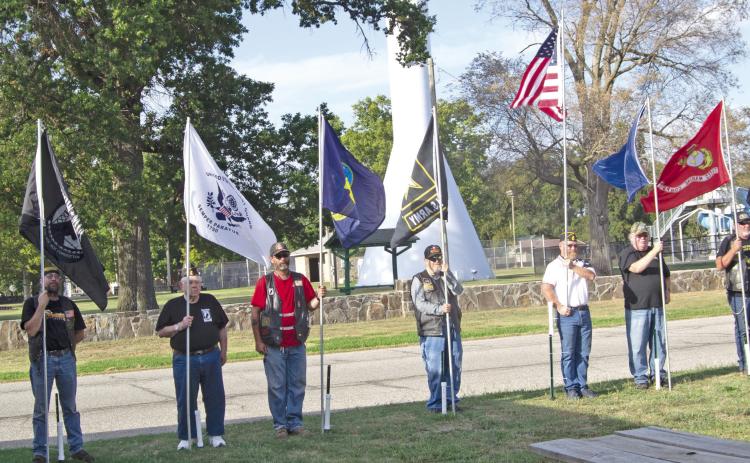 Wayne Dobkins ,Dewey Smith, Jesse Pryor, Aron Davolt, Randy Bass, Mike Wahl, Steve Jameson, Martinez and Chuck Dawe (not in order) were among those holding flags representing the various armed services during the annual Watchfire ceremony held September 17.