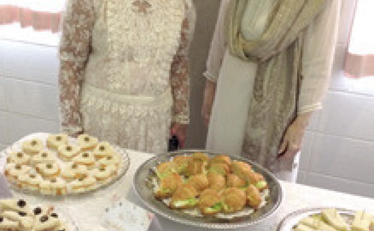 Hostesses for the February 6 Chapter BT of P.E.O. International luncheon tea were Alma Cook and Betty Karnes. Courtesy photo.