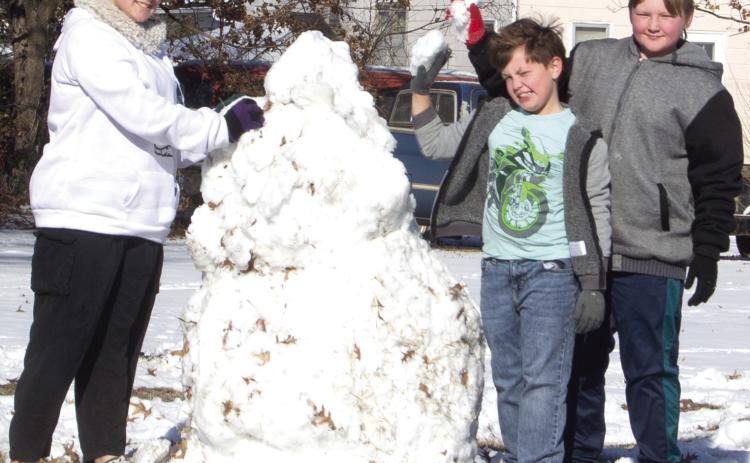 With the weekend snow came snowmen. Three youngsters built two snowmen on Maple Avenue Saturday. They are Zoey Clark, Brodie Robinson and Sully Clark.