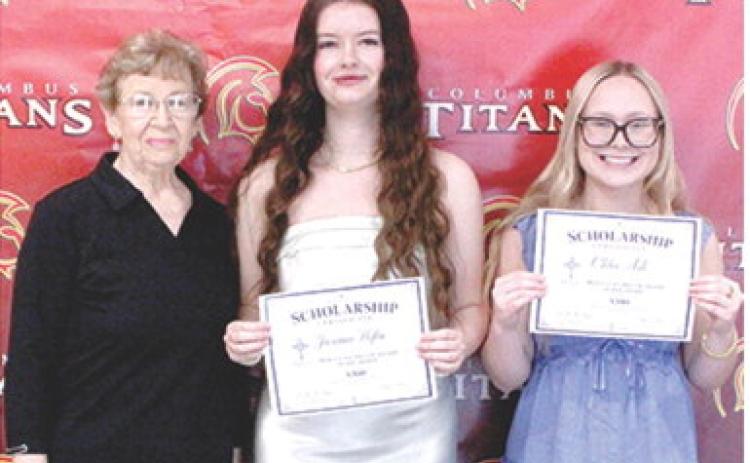 Jacianna Heflin and Chloe Ash, Columbus Unified High School Seniors, received $300 scholarships from the Mercy Columbus Auxiliary from Auxiliary Representative, Lucille McNemar, during the 2026 Senior Assembly, May 15, at the CUHS Gymnasium.