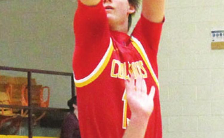 Titan Junior, Kolt Ungerheuer, shots for three in the, 52-58, Columbus loss to the Trojans in Girard, Tuesday. Kolt led the Titans with 16 points.