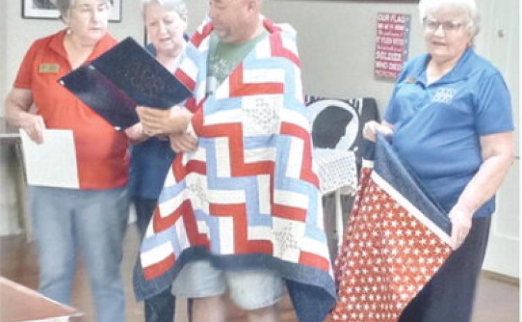 A Quilt of Valor was presented to Sgt. Christopher Moss August 19 at the Baxter Springs American Legion. Moss served in the United States Army from 20082018. He had several duty stations, including Afghanistan for a year in Sharama driving supply trucks for route clearance, then served with the Special Forces for the rest of his tour. Courtesy photo.