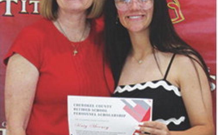 Katy Mooney received a $400 scholarship from the Cherokee County Retired School Personnel from Regina Jameson during the 2025 Senior Assembly, May 16, at the CUHS Gymnasium.