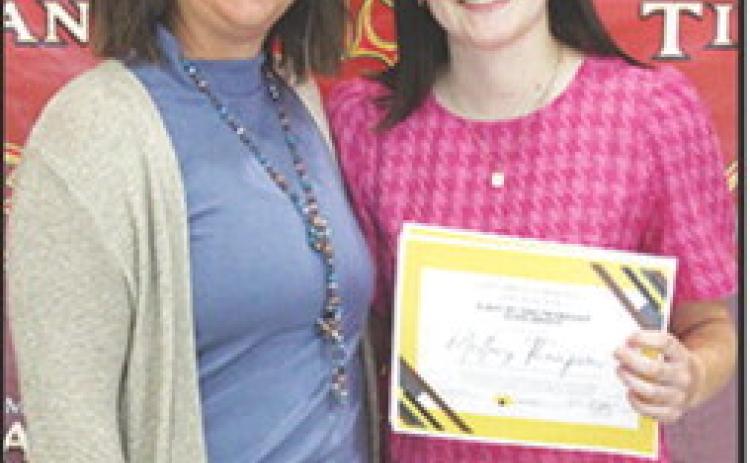 Mallory Thompson received the Columbus Community Foundation 1986 Friendship Scholarship in the amount of $500 at the Senior Assembly, May 16, in the Columbus Unified High School Gymnasium. Mallory also received the Charles and Jane Maxwell Memorial Columbus Community Foundation Scholarship in the amount of $1,000. Kelly Walters, USD 493 Title 1 Reading Specialist made the presentations.