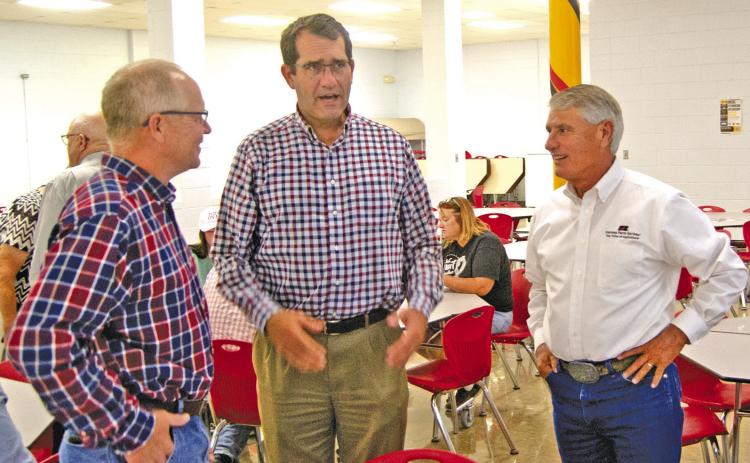 State Representative Dale Helwig talked with U.S. Representative Derek Schmidt and Farm Bureau executive Joe Newland at the Cherokee County Farm Bureau annual meeting on Monday evening.