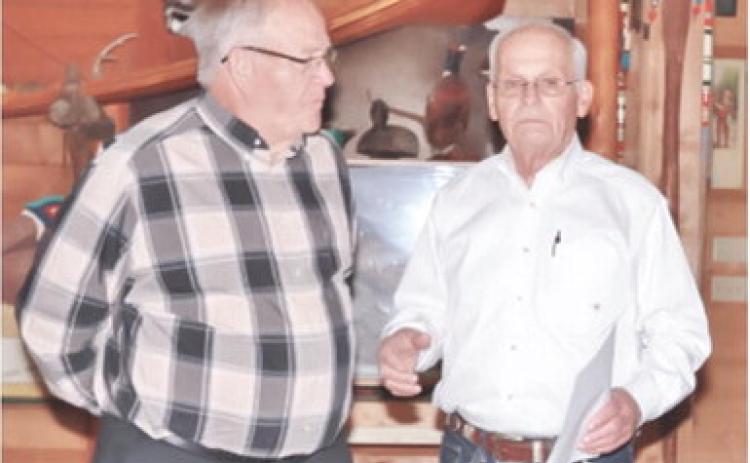 Retired manager of Big Brutus park and museum Joe Manns was presented with the coveted Miner’s Award at the corporations recent annual meeting held at Rowden’s Rustic Moose Lodge in Columbus. The award was presented by Big Brutus Board President Jim Lovell. Photo by Emmett Sullivan.