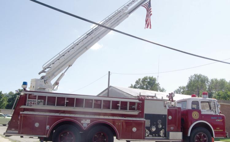 The Hot Rod and Hoses week-end at Scammon featured this West Mineral ladder truck holding the American Flag over the car show. The Saturday event had a big turnout.