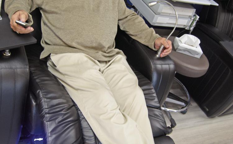 Steve Dunlap tests the comfort of the new Infusion Center reclining chairs. Patients may also choose heat or vibration while receiving infusion treatments.