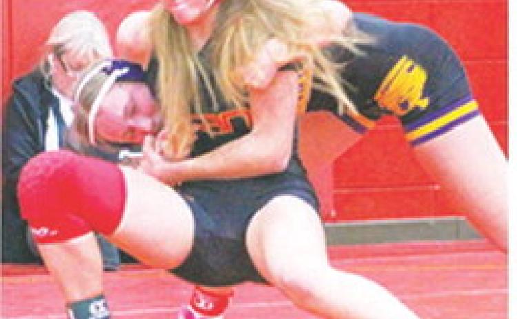 Lady Titan Sophomore, Cara Altis, swept her five matches during the Columbus Duals Tournament Friday Night at the Columbus High School Gymnasium. Cara collected four wins by pin and one in a 5-1 decision against a tough Coffeyville opponent in the 125-weight class. Columbus will travel to Pittsburg for their first matches following the Christmas Break.