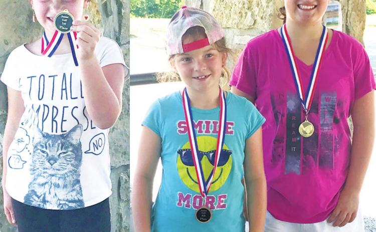 Three Smiley Sisters earned three medals, two first place and one fourth at the SEK Junior Golf Tournament in Coffeyville, Tuesday. Alaina placed first in the 7-8 year-old girls division. Lyndee placed fourth behind Fallon who was the top medalist in the girl’s 9-11 age division. Courtesy Photos.
