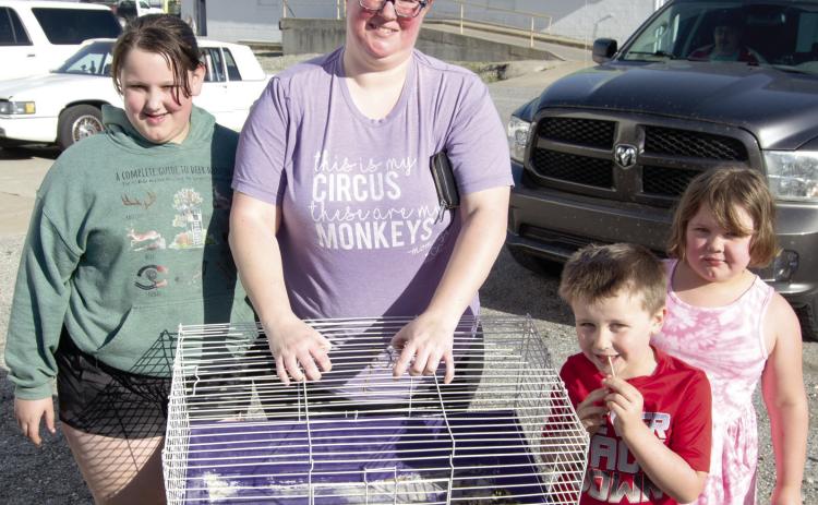 Chick Day at Columbus Farmer’s Coop drew a large interest in buying baby chicks. With their purchases Ema Reynolds, Angela Aldrighetti, Donny and Ellis Reynolds. There were 12 different breeds of chicks available.