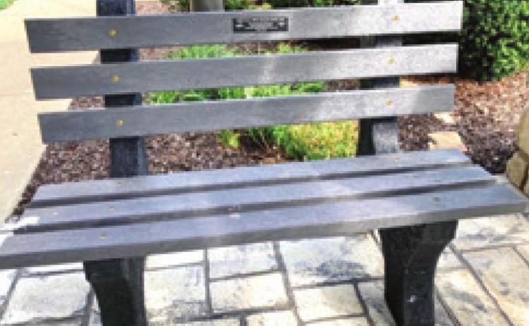 Local Girl Scouts recycle bottle caps to create new bench