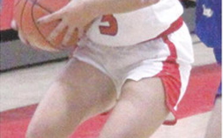 Lady Titan Senior, Brylie Johnson, looks off St. Mary’s-Colgan Junior, Jakayla Davis as she brings the ball down during the Friday, home opener loss, 26-72, at the CUHS Gymnasium.