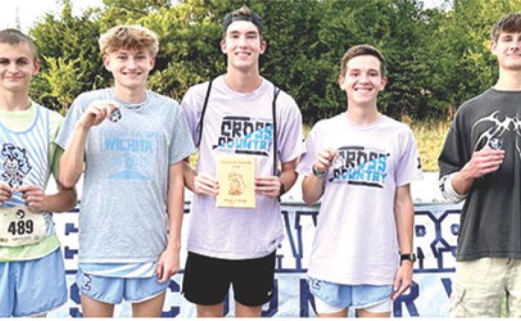 The Southeast Lancer Boys Cross Country Team earned the team title in Thursday’s home meet at the Weir Baptist Camp. Team members are James Maxton, seventh; Chris Archey, fourth; Henry Burns, 32nd; Hudson Locke, third; Tucker Sutton, second. Photo by Julie Jones.