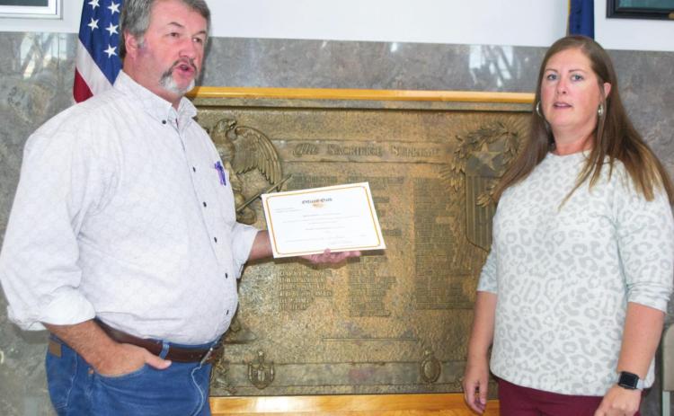 County Clerk Kyle Rennie swears in Raven Elmore as a County Treasurer in the Cherokee County Courthouse Monday, October 11. Elmore’s family awaited her after the County Commissions meeting to celebrate her role with their own photo opportunity in the building. Photo by Jacob Spencer.