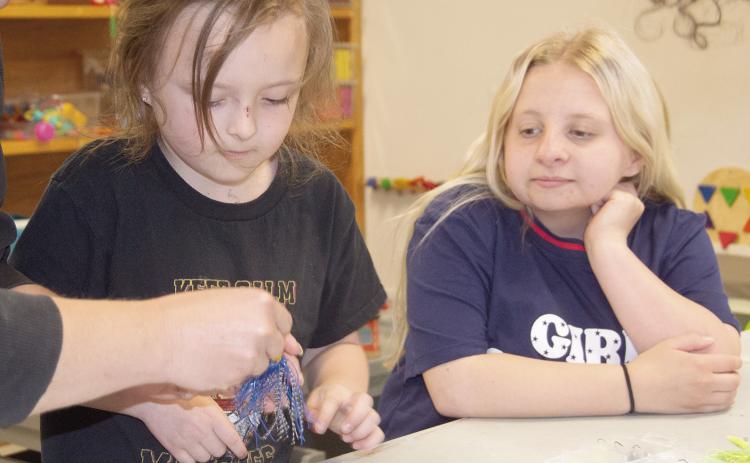 Columbus Public Library recently held a tackle box workshop for kids. Chiildren were able to build their own tackle boxes. Adaline Jameson and Layla Stewart enjoyed adding lures to their boxes during the event. News Report photo by Tanya Woolsey.