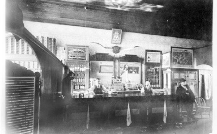 Early saloons could be very plain or very elaborate, with the latter often serving as a meeting hall or a place to receive mail, use a toilet, or read a newspaper. Courtesy Kansas Historical Society