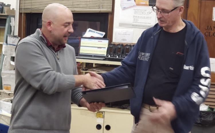 Columbus Post Master Tyler Speer presented long time postal carrier Martin White with a certificate recognizing his years of service and celebrating his retirement. White began in 1997 as a temporary substitute rural carrier. White has spent his entire career in Columbus. Courtesy photo.