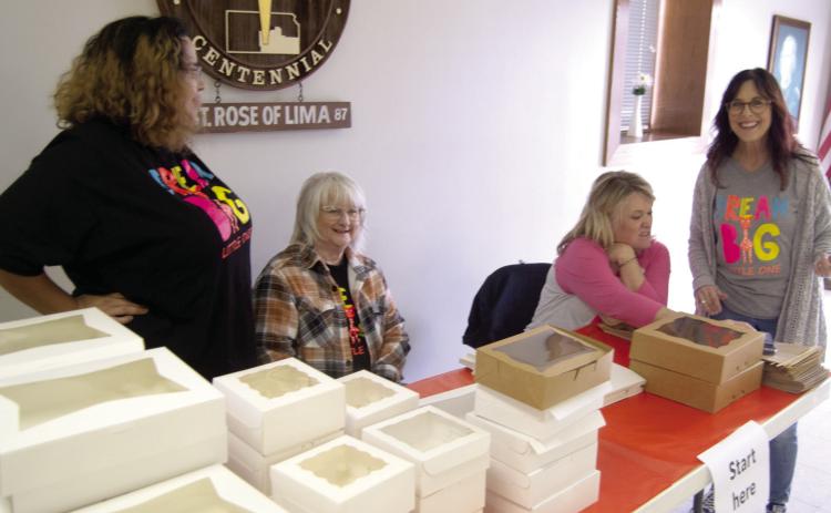 The annual Dream Big Little Ones fund raiser on Sunday was a busy place. The starting place was busy as the volunteers unfolded the boxes and assisted the cookie buyers