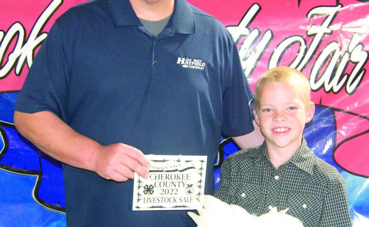 Beckett Asher, Lone Elm Beavers sold his Grand Champion chicken for a $1,000 premium during the livestock auction. Brian Wellmeier purchased the bird on behalf of Jay Hatfield Chevrolet.