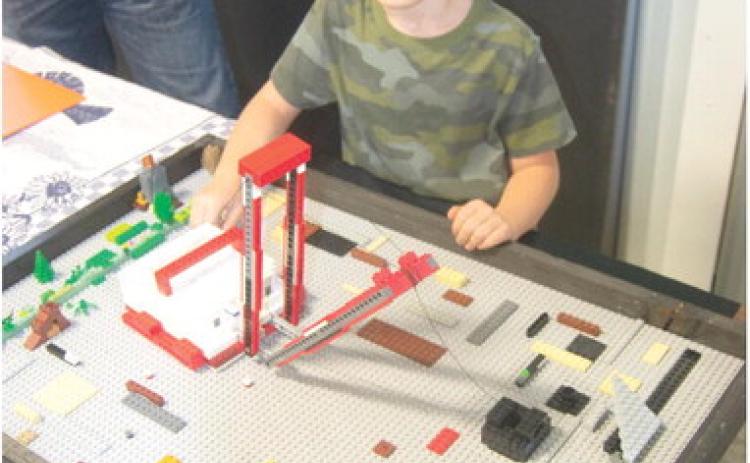 Among the exhibits at the Columbus Museum for the next few weeks will be the Lego constructed model of the “Big Muskie” dragline built by Luke Rowton. Luke said the Big Muskie was dismantled for scrap in 1999. He has also built Lego models of several other shovels including Big Brutus. His model actually works dragging the “coal bucket.”
