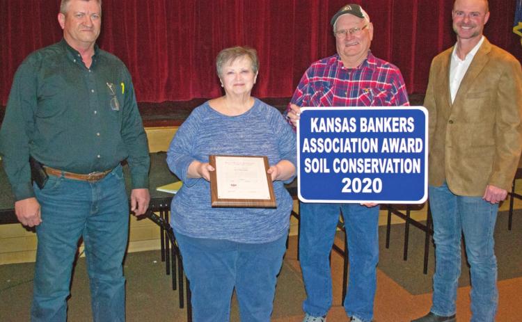 The annual Kansas Bankers Association Conservation award was presented to Pat and Joe Carlson recognizing their efforts to conserve water and soil on their 160 acre family farm. The Carlson’s farm has been in their family for 160 years.