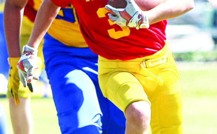 Cam Carter was a workhorse for the Titan Fifth and Sixth Grade Team in their 30-6 rout of the Parsons Vikings, Saturday at Titan Stadium. Photo by Kristin Sharp.