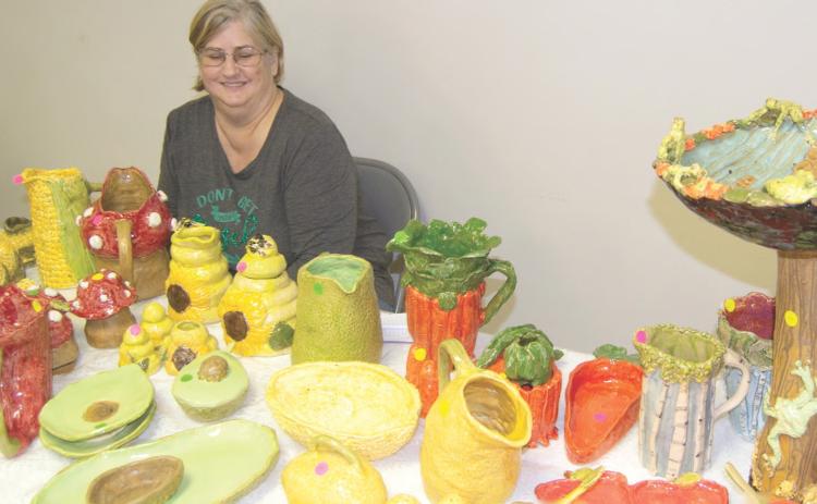 Unusual pottery filled one of the tables at the Holiday Fair. Sheri Tremblay had some unique clay items.